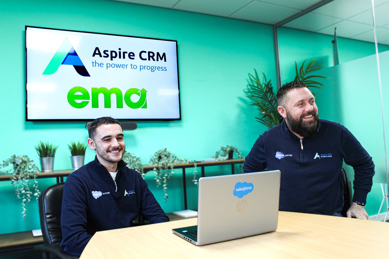 Learner and their employer sitting at a table with a laptop in front of them