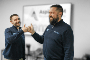 Apprentice benefit - Employer and apprentice smiling while shaking hands